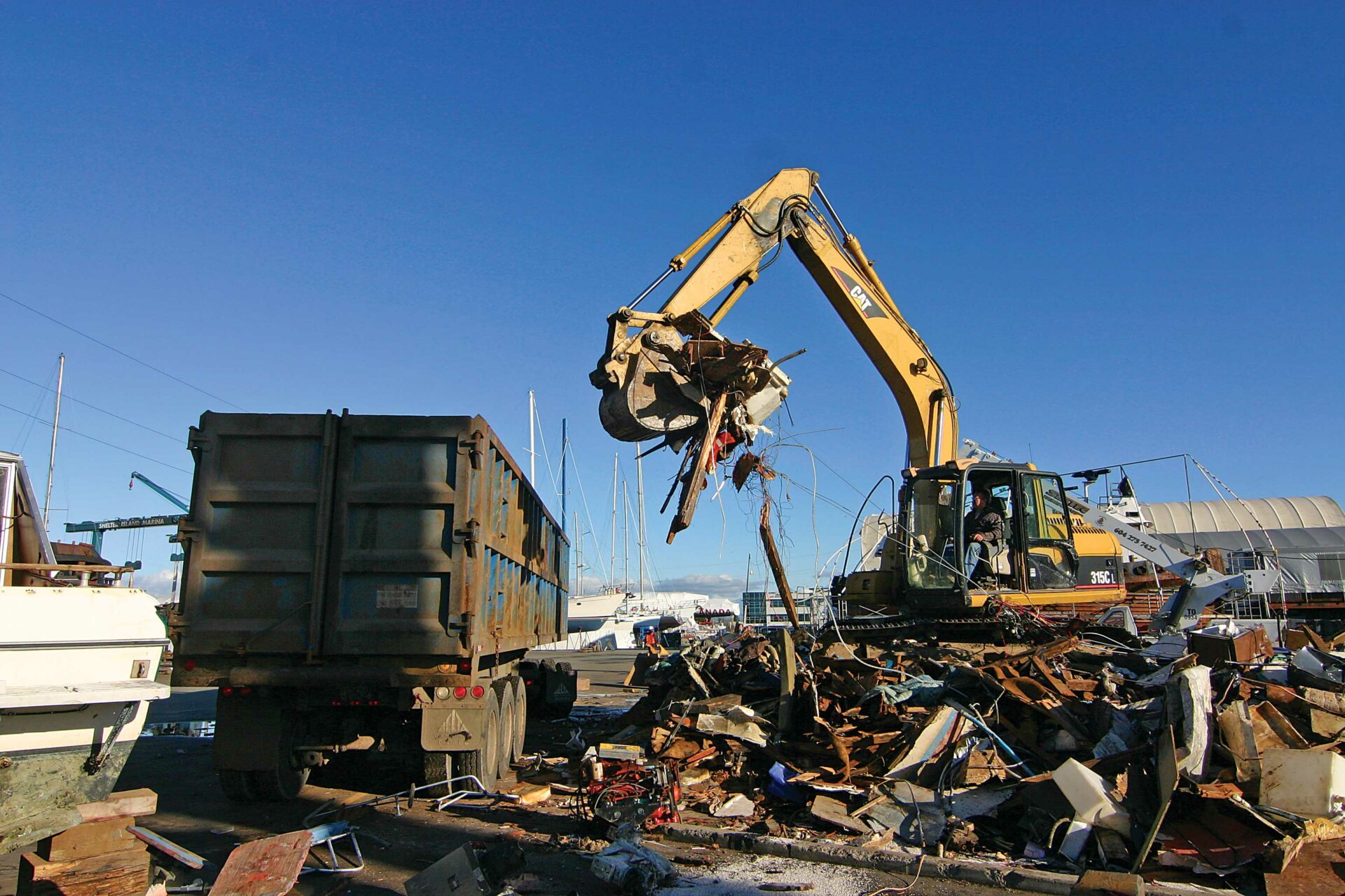 From beginning to end, the crushing of this once proud sailboat took only 20 minutes. Photo by Sam Burkhart.