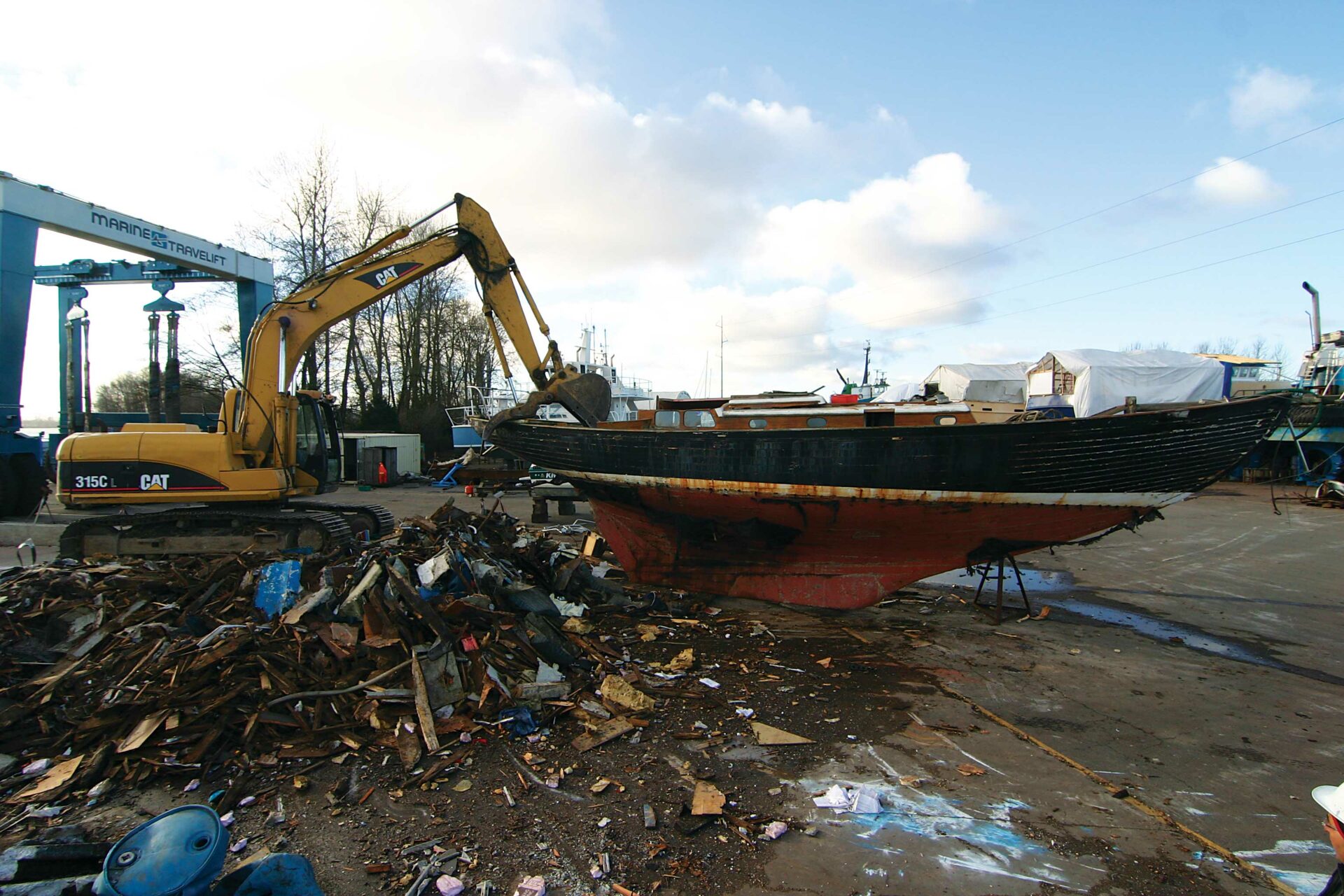 Breaking up a boat at Shelter Island Marina.