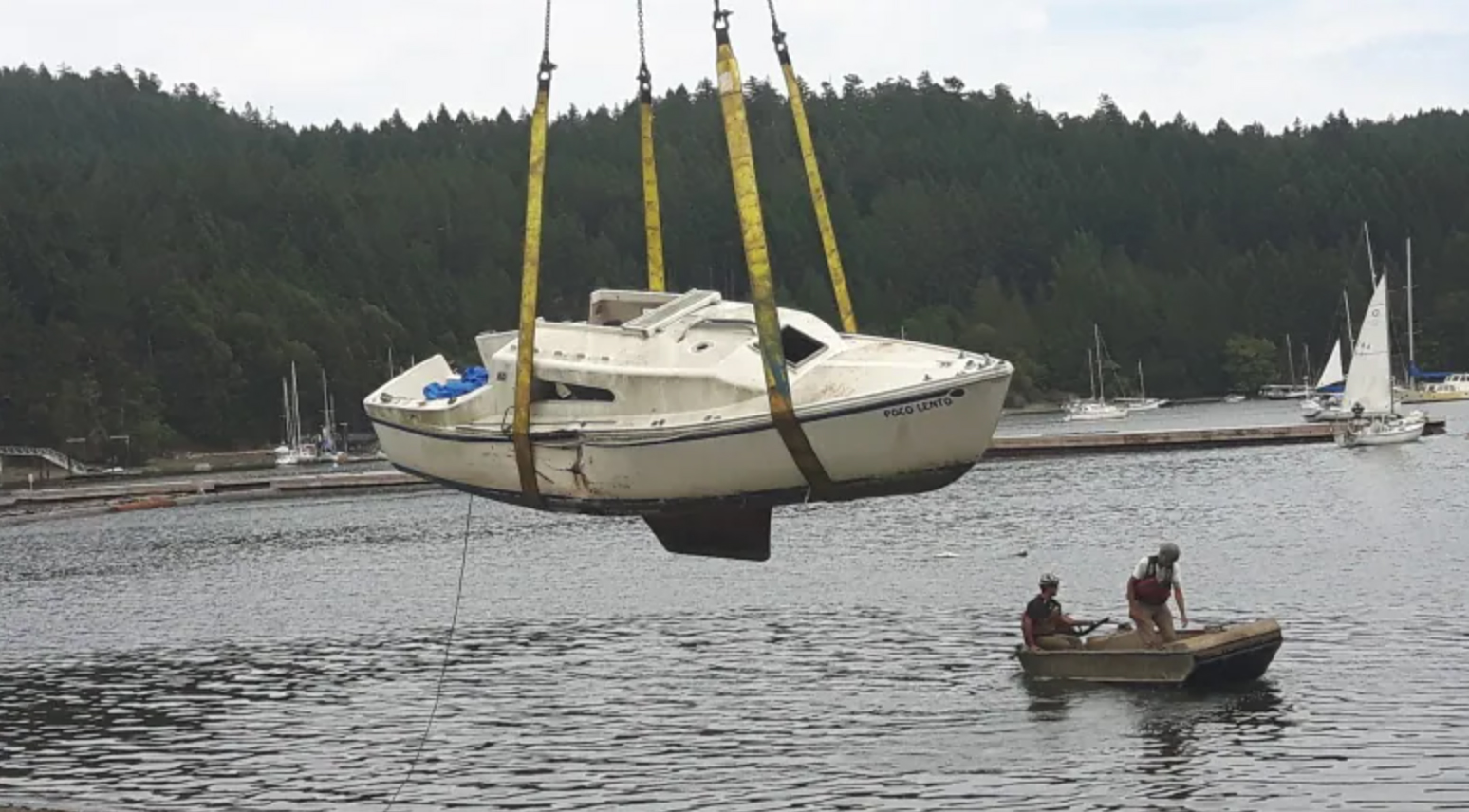 A derelict boat is hauled out of B.C. waters. (John Roe/Dead Boat Disposal Society)