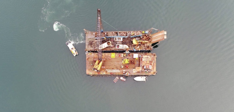 A Salish Sea Industrial Services crane and barges collect boats near Fulford Harbour. GEOFF MULLINS, GKM RESEARCH.